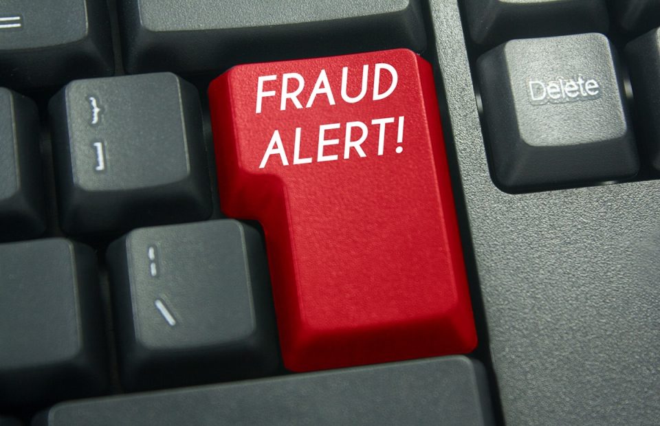 a keyboard key that says “fraud alert!”