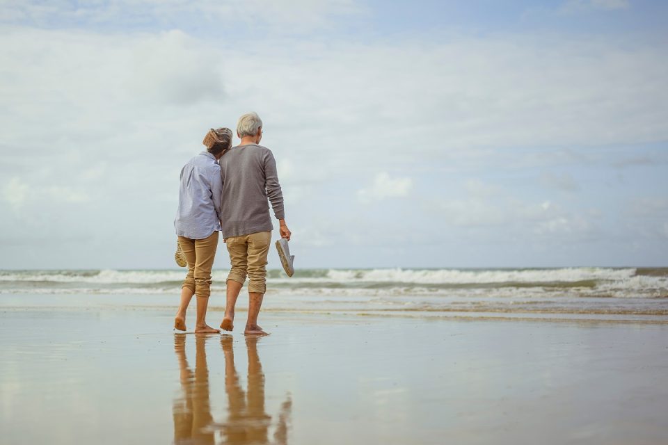 couple enjoying beach stroll