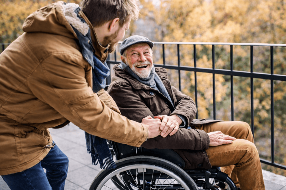 Son with dad in wheelchair